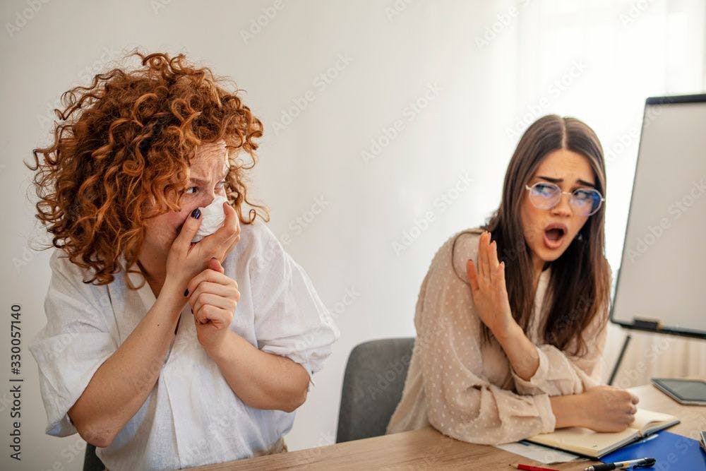 Woman sneezing at work ©Dragana Gordic-stock.adobe.com