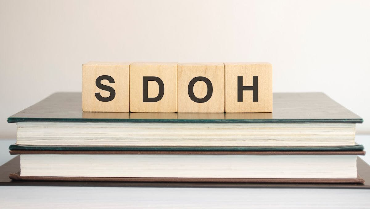 SDOH block letters on books: © Andrey - stock.adobe.com