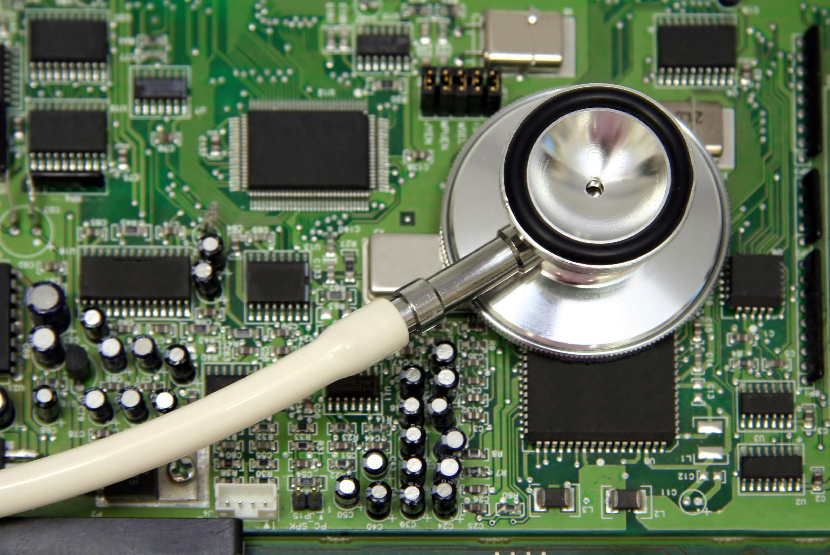 stethoscope on computer circuit board