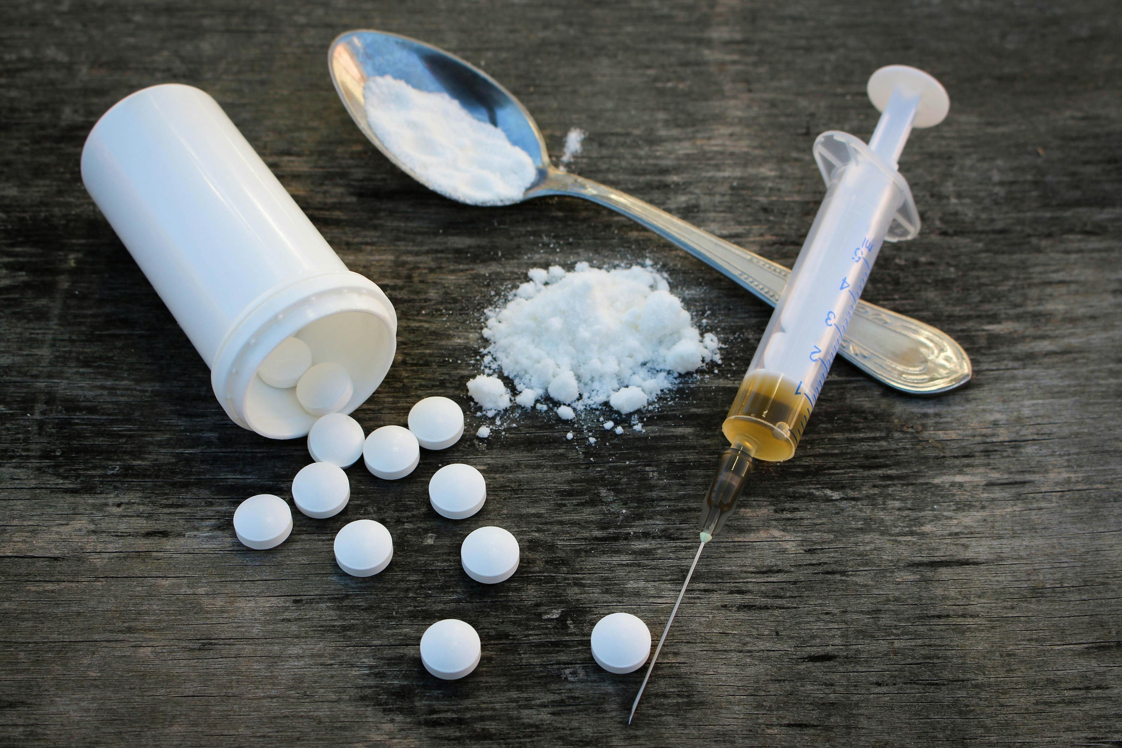 Image of pills, syringe and white powder ©Victoria М-stock.adobe.com