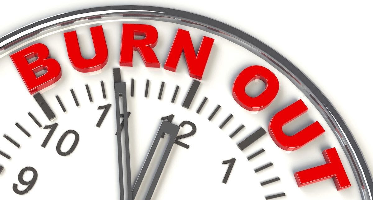 burnout written on clock