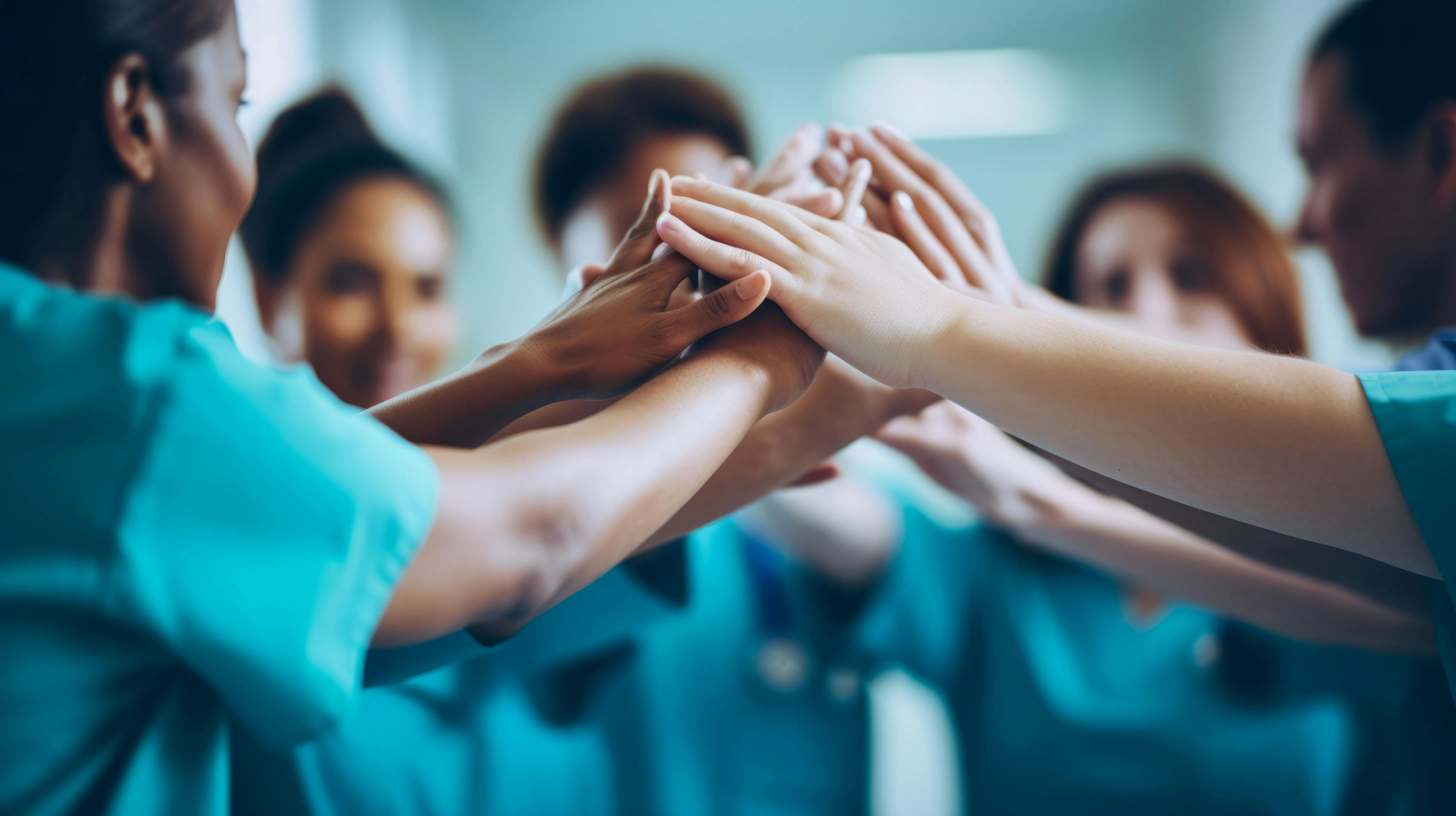 physicians high-fiving © Peopleimages - AI - stock.adobe.com