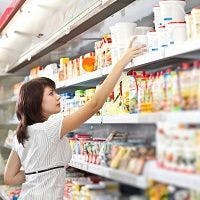 Woman at store shelf