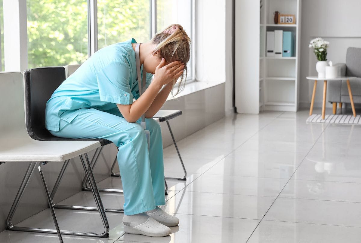 sad nurse in clinic: © Pixel-Shot - stock.adobe.com