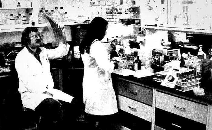 Dennis Kleid and a colleague in the molecular biology lab, in a photograph from the Genentech archives. Kleid was one of a team of scientists who worked on the human insulin research effort. Image Credit: Courtesy of the Genentech archives