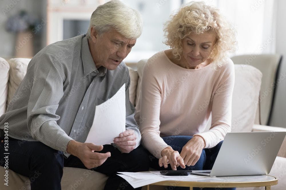 older couple reviewing medical bills ©fizkes-stock.adobe.com