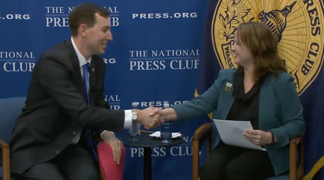American Medical Association President Jesse M. Ehrenfeld, MD, MPH (left), shakes hands with National Press Club President Eileen O’Reilly after Ehrenfeld's keynote address there on Oct. 25, 2023. This image was taken from the live webcast of the event.