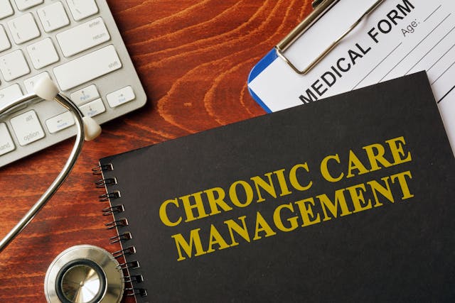 Chronic Care Management book on table next to stethoscope ©Vitalii Vodolazskyi stock.adobe.com